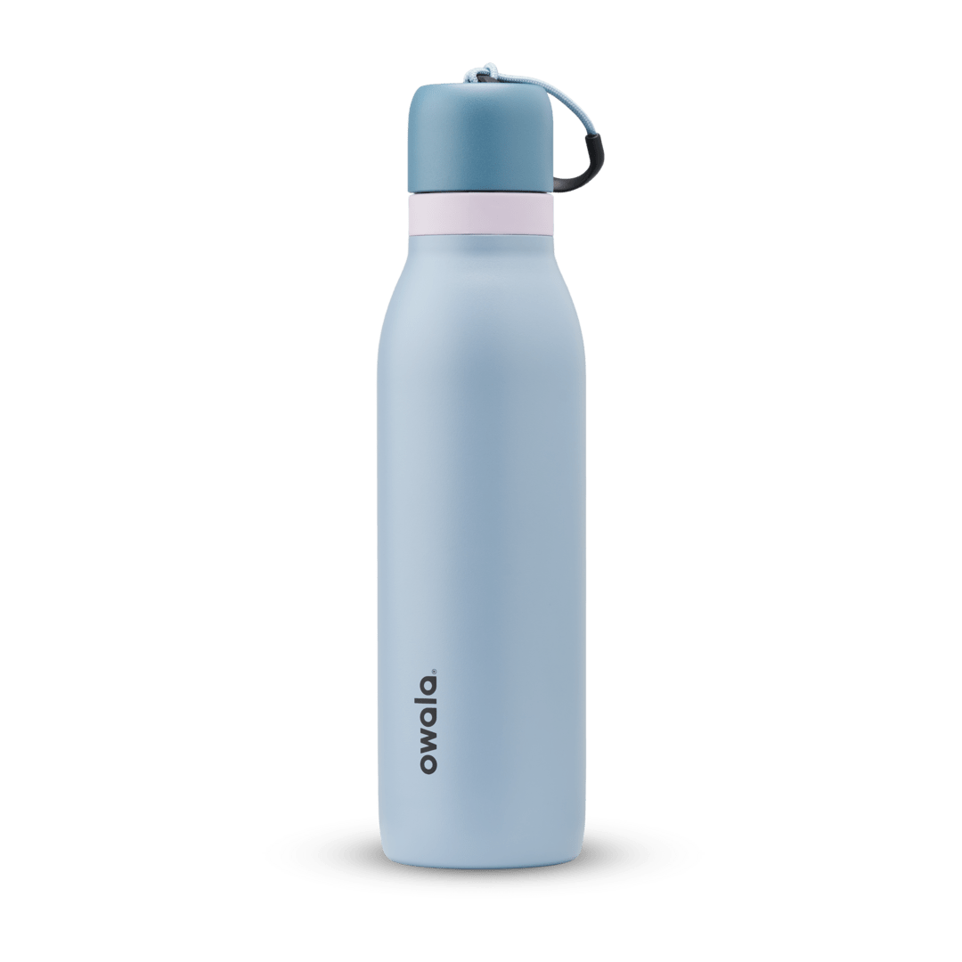 FreeSip Twist 24oz, coral pink body with orange-red lid and purple band; slim insulated bottle