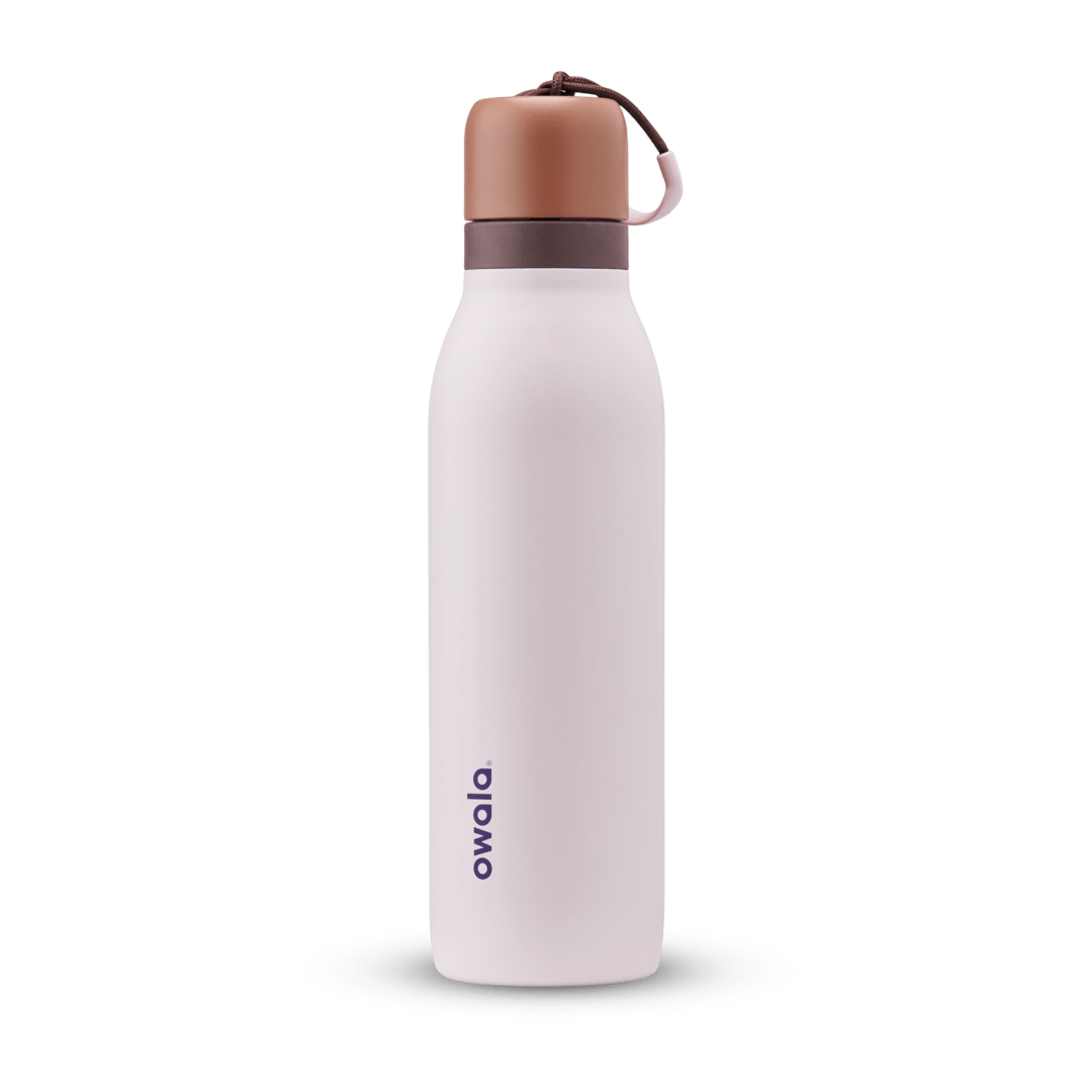 FreeSip Twist 24oz, coral pink body with orange-red lid and purple band; slim insulated bottle